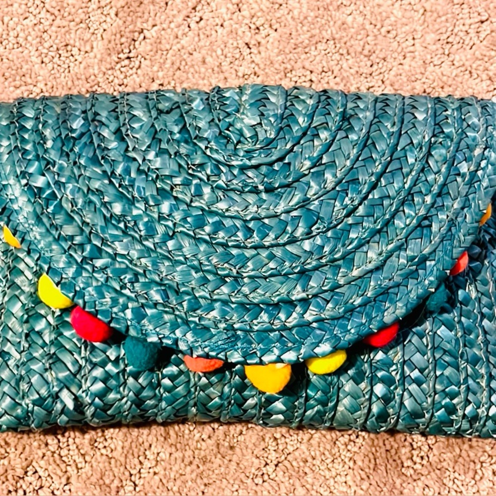 Chantecaille clutch bag with Pom poms